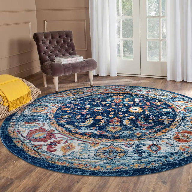 Round navy distressed area rug with colorful central medallion and border