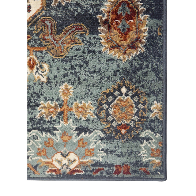 Rectangle area rug in muted teal blue with orange and beige floral geometric motifs