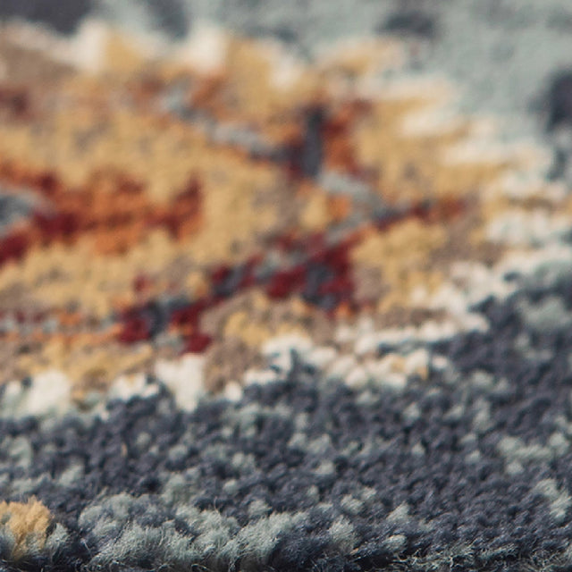 Close-up of teal blue area rug surface with multicolor flecked pattern and soft pile