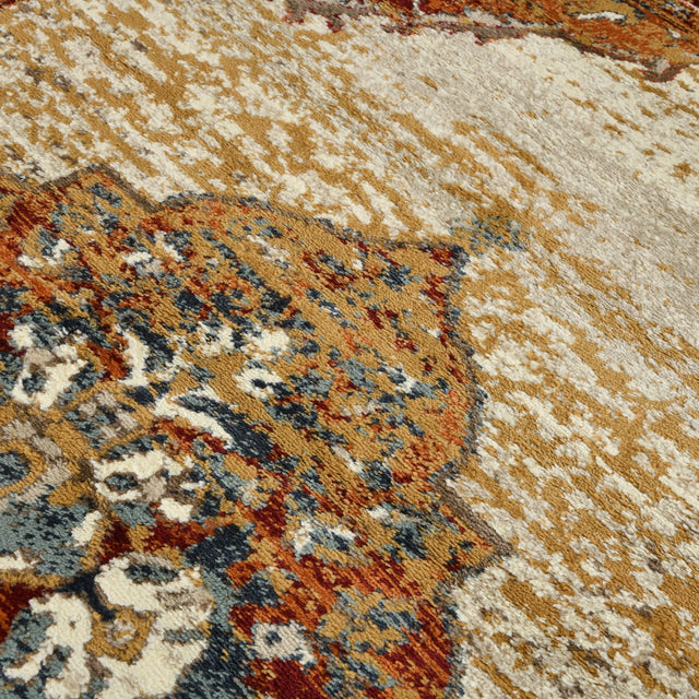 Multicolor distressed area rug section with beige ground and floral medallion motifs.