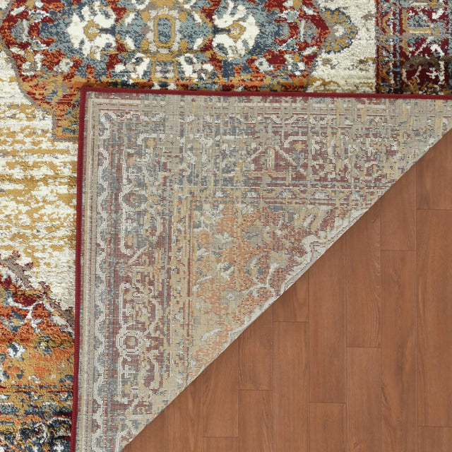 Beige rectangular area rug with distressed medallion pattern and multicolor border, flat weave.