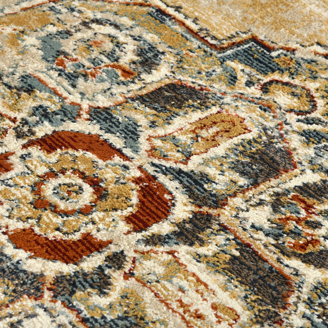 Rectangle area rug close-up of detailed scrollwork in beige, blue, and rust
