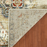 Rectangle area rug corner view with beige and gold tones, blue and rust motifs