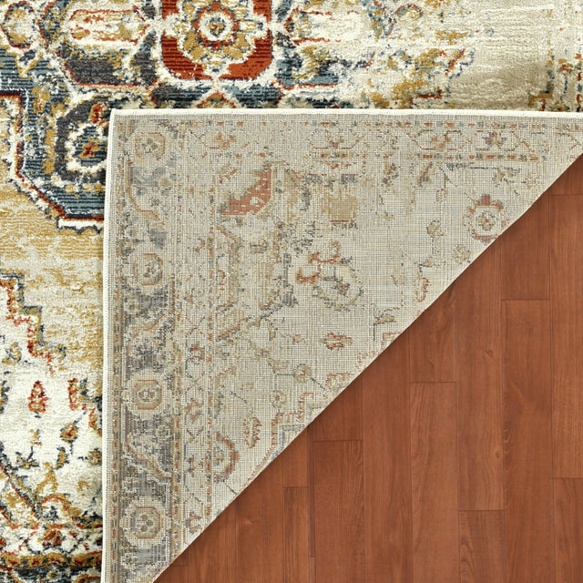 Rectangle area rug corner view with beige and gold tones, blue and rust motifs