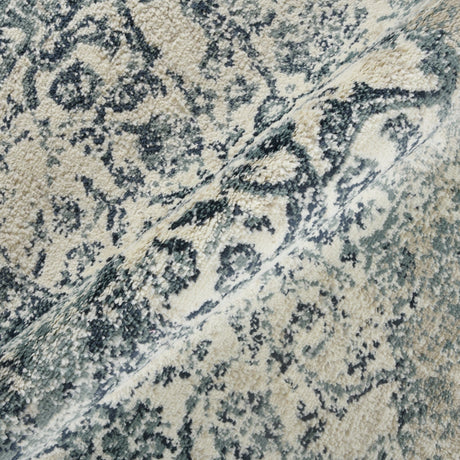 Blue and ivory area rug close-up texture with distressed floral medallion