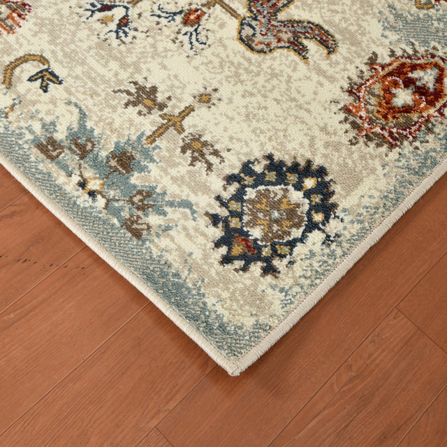 Beige oriental area rug with navy, rust, and light blue floral medallions