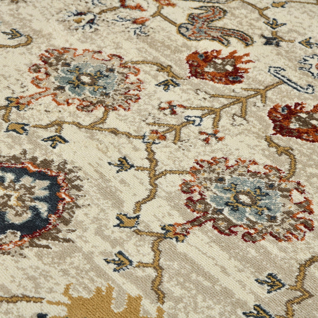 Beige oriental area rug with navy, red, and gold floral medallion pattern