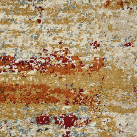 Detailed abstract rug pattern in ivory, burnt orange, blue, and dark speckles