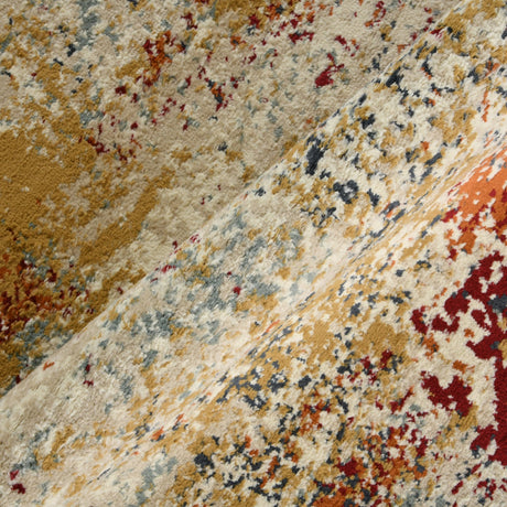Rug corner with textured ivory pile and scattered red, orange, and navy pattern