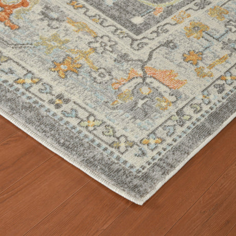 Bordered taupe rug with multicolor geometric pattern; flatwoven texture edge.