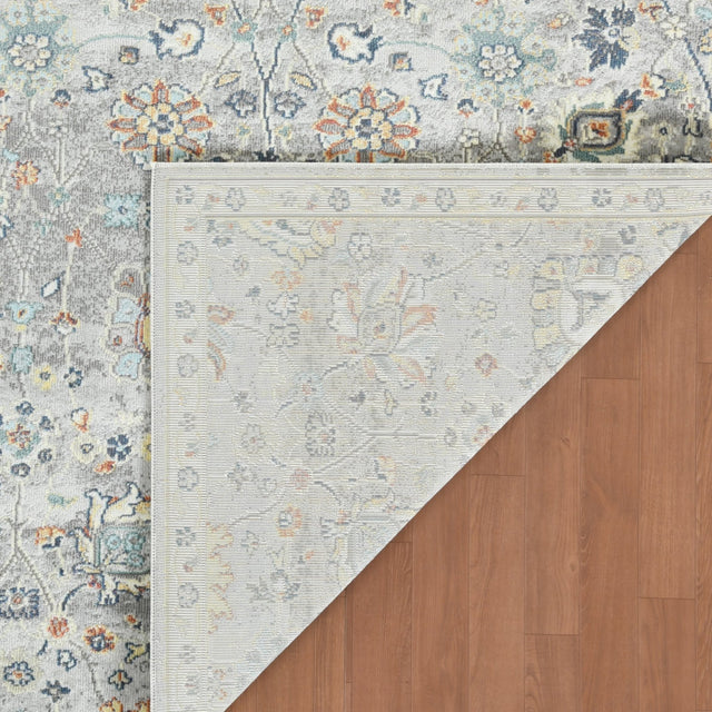 Gray bohemian floral area rug with multicolor medallion border, corner view