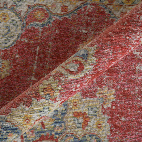 Multicolor rug corner detail with burgundy red and cream medallion motifs
