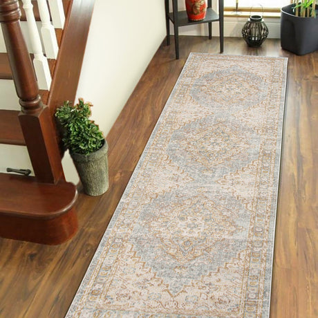 Rectangular vintage-style runner rug with distressed medallion design in ivory and gray