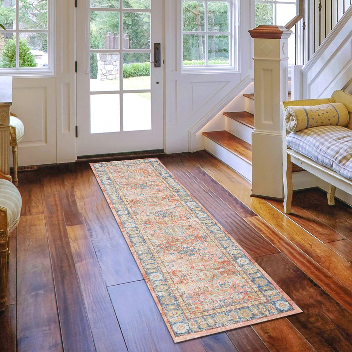 Runner area rug with multicolor distressed medallion pattern in bright room