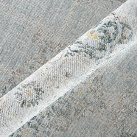 Sea mist medallion area rug close-up with textured border stripe and speckled pattern