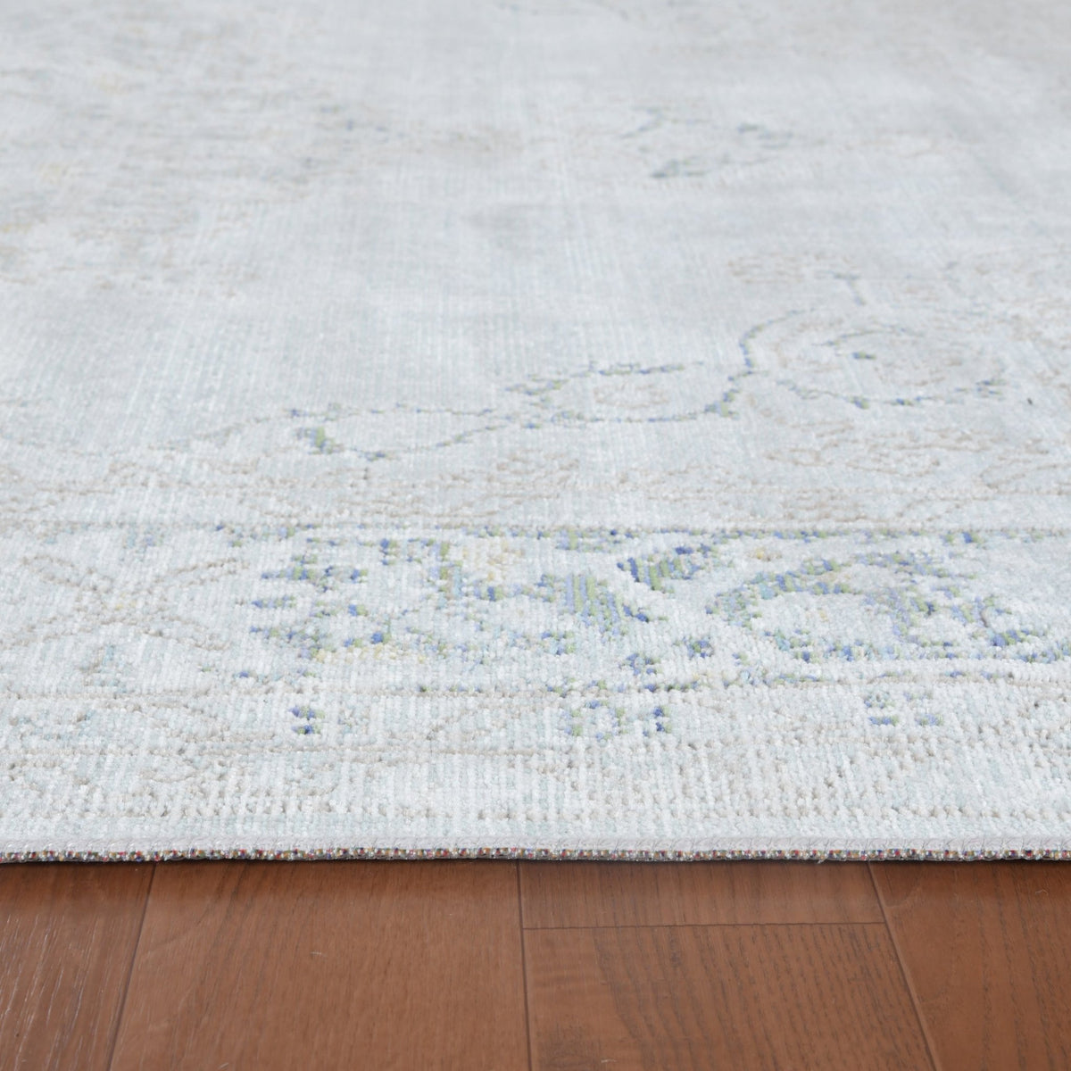 Sea mist medallion area rug flatweave texture with faded blue floral center motif