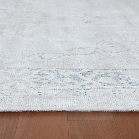 Sea mist medallion area rug flatweave texture with faded blue floral center motif