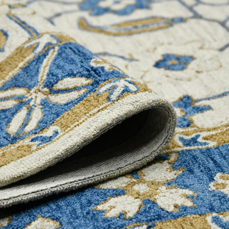 Hand-hooked floral area rug rolled edge showing underside backing in gray