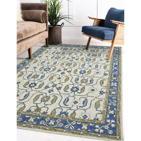 Hand-hooked floral area rug with cream background, royal blue and gold geometric floral pattern