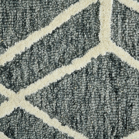 Close-up of textured gray rug with off-white diamond lattice pattern
