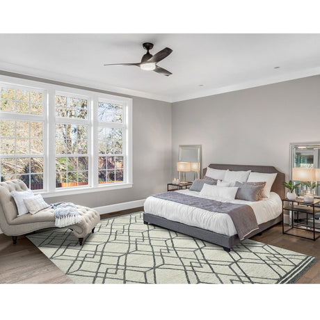 Ivory and dark gray geometric area rug in a rectangular pattern