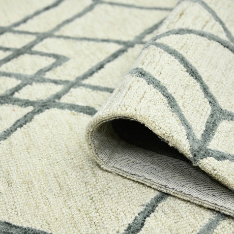 Ivory geometric area rug with dark gray border lines and low rolled edge detail