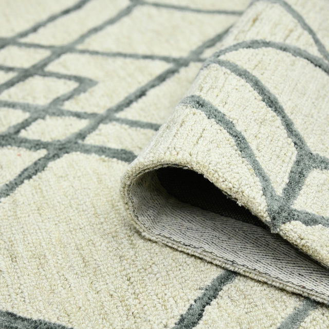 Ivory geometric area rug with dark gray border lines and low rolled edge detail