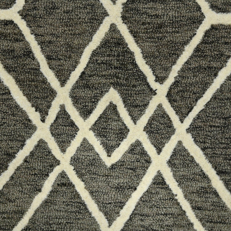 Hand-hooked area rug with off-white geometric lattice pattern across dark khaki pile.