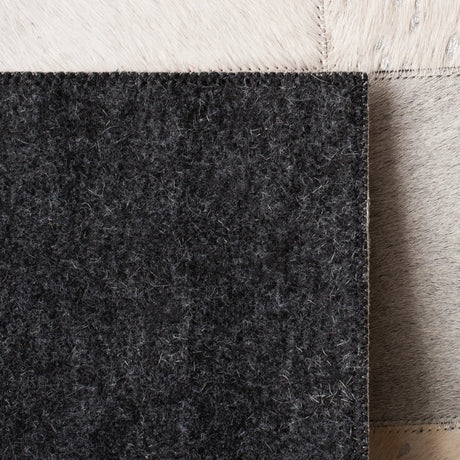 Safavieh Studio Leather 4'-0" x 6'-0" Rug in Ivory / Silver