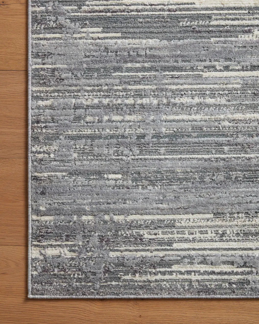 Loloi Arden Ard-03 Grey/Ivory Rug - corner on wood