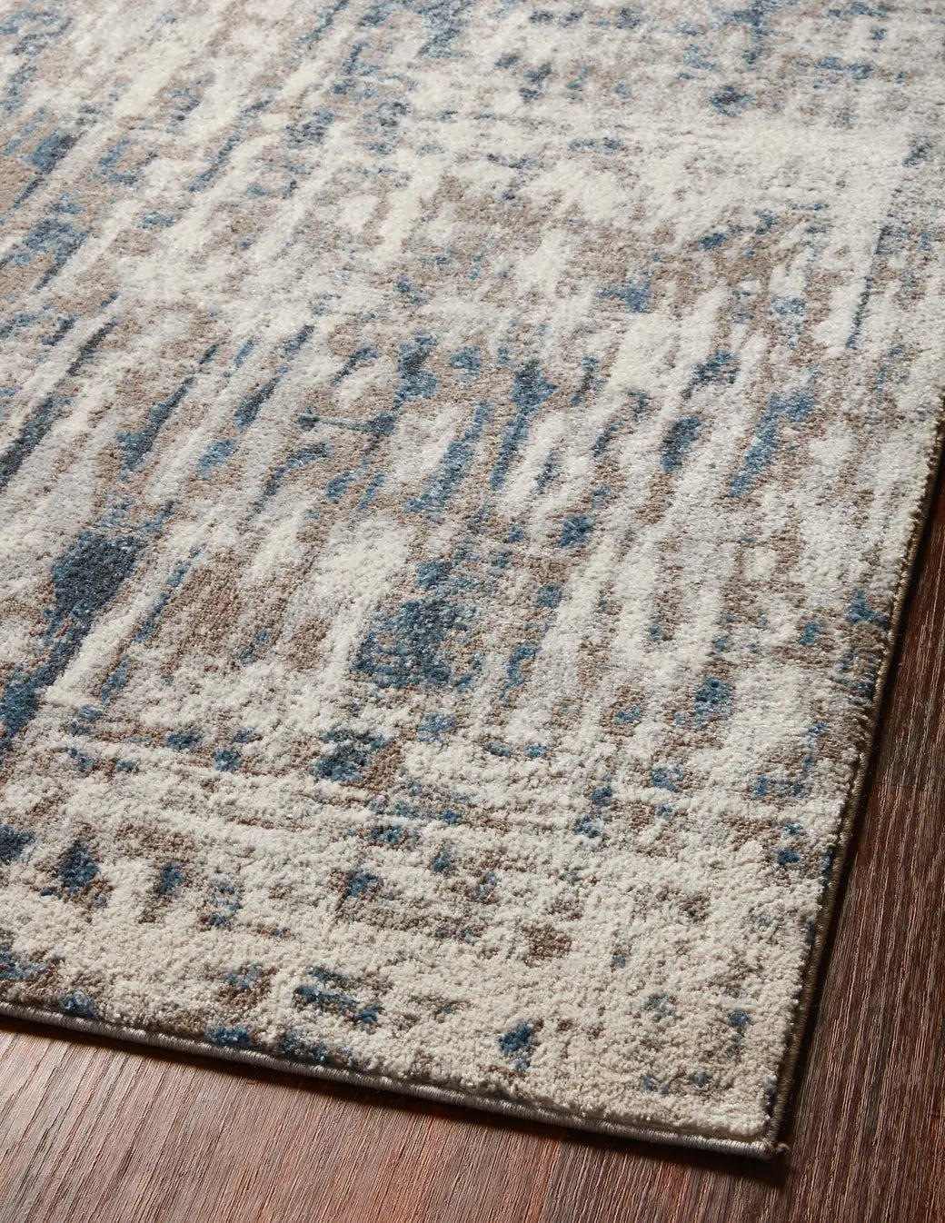 Loloi Spirit Spi-02 Stone/Blue Rugs - angled corner on wood