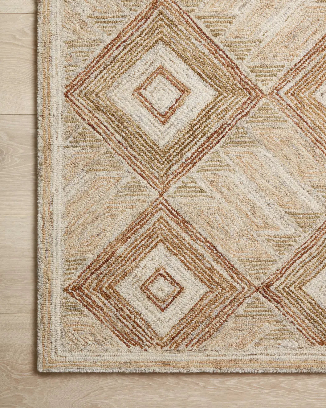 Loloi Varena Var-01 Sand/Clay Rug - corner on wood