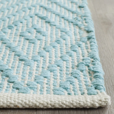 Safavieh Montauk 5'-0" x 7'-0" Rug in Turquoise / Ivory