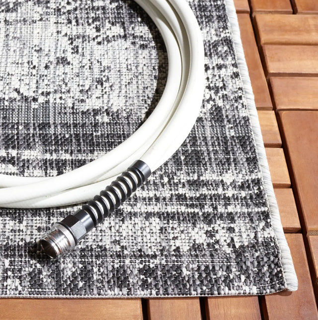 Safavieh Courtyard 5'-3" x 7'-7" Rug in Grey / Black