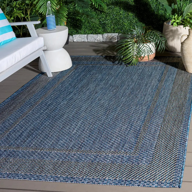 Safavieh Courtyard 5'-3" x 7'-7" Rug in Navy / Grey