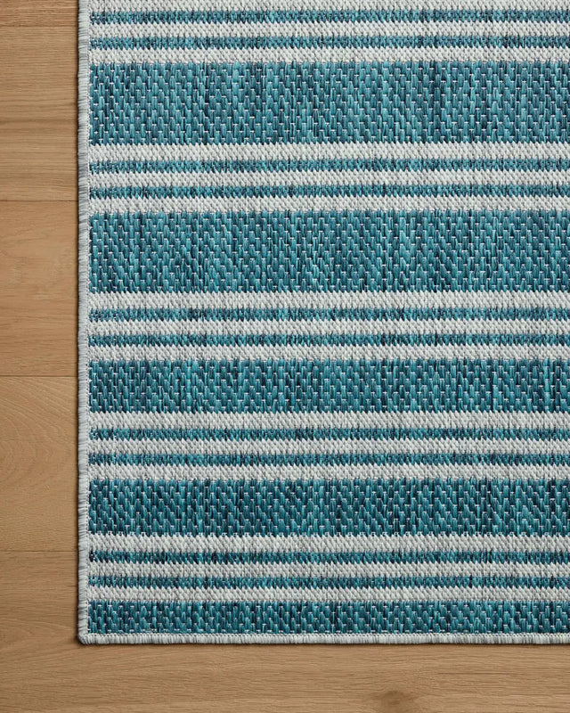 Loloi Easton ESN-04 Teal / Fog Rug - corner on wood