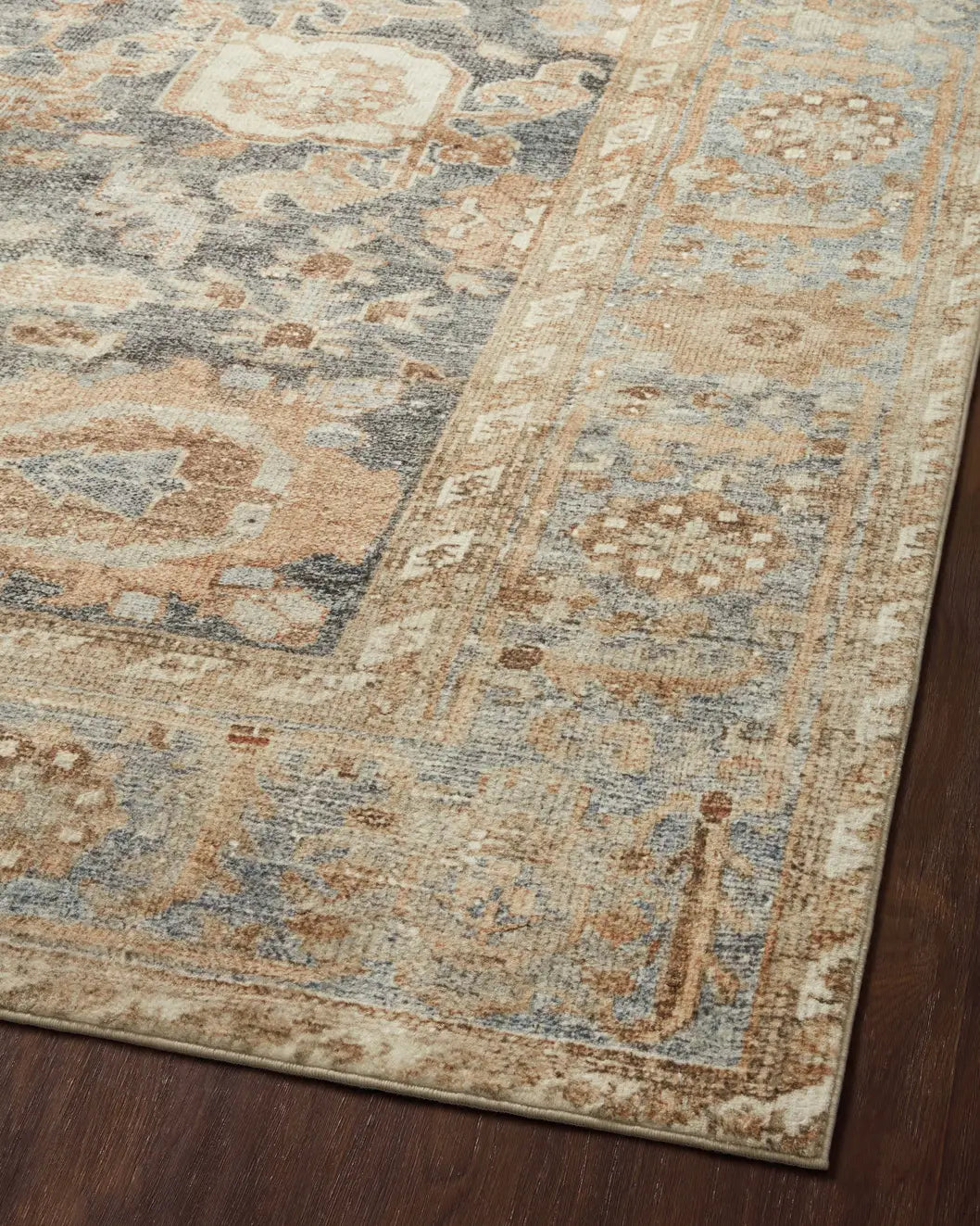 Loloi Margot Mat-03 Ocean/Spice Rugs - angled corner on wood