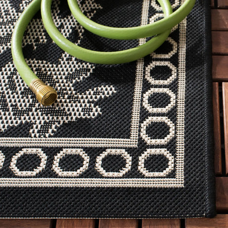 Safavieh Courtyard 5'-3" x 7'-7" Rug in Black / Sand