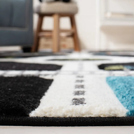 Safavieh Carousel Kids 100 4'-0" x 6'-0" Rug in Black / Ivory