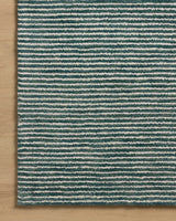 Loloi Sunday SUN-01 Ocean / Ivory Hand Tufted Rug - corner on wood
