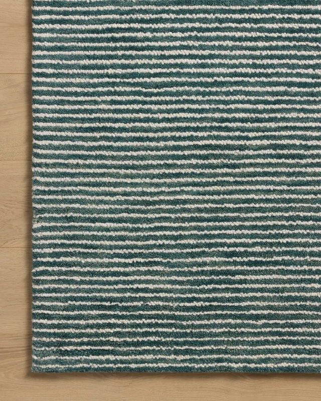 Loloi Sunday SUN-01 Ocean / Ivory Hand Tufted Rug - corner on wood