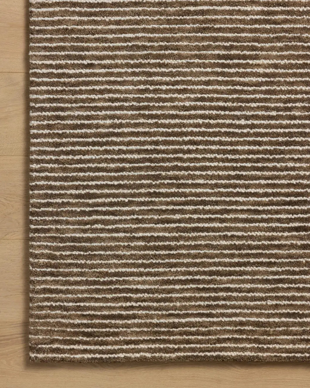 Loloi Sunday SUN-01 Mocha / Ivory Hand Tufted Rug - corner on wood