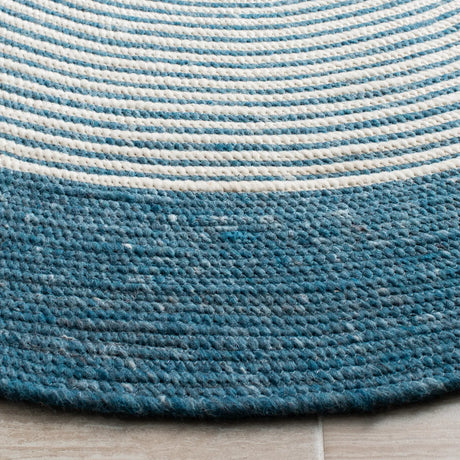 Safavieh Braided 5'-0" x 7'-0" Rug in Teal / Ivory