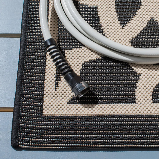 Safavieh Courtyard 5'-3" x 7'-7" Rug in Black / Beige