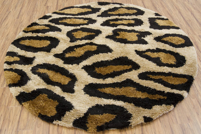 Chandra Amazon AMA-5602 Tan and Gold and Brown and Black round rug, flat view