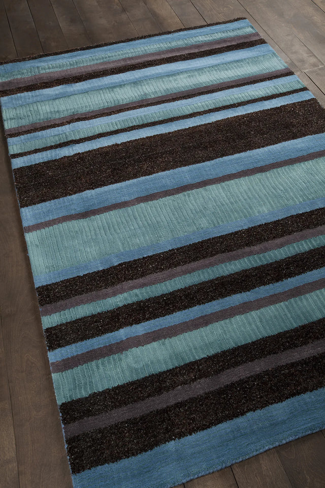 Chandra Amigo AMI-30502 Blue and Grey and Charcoal rug, angled side view