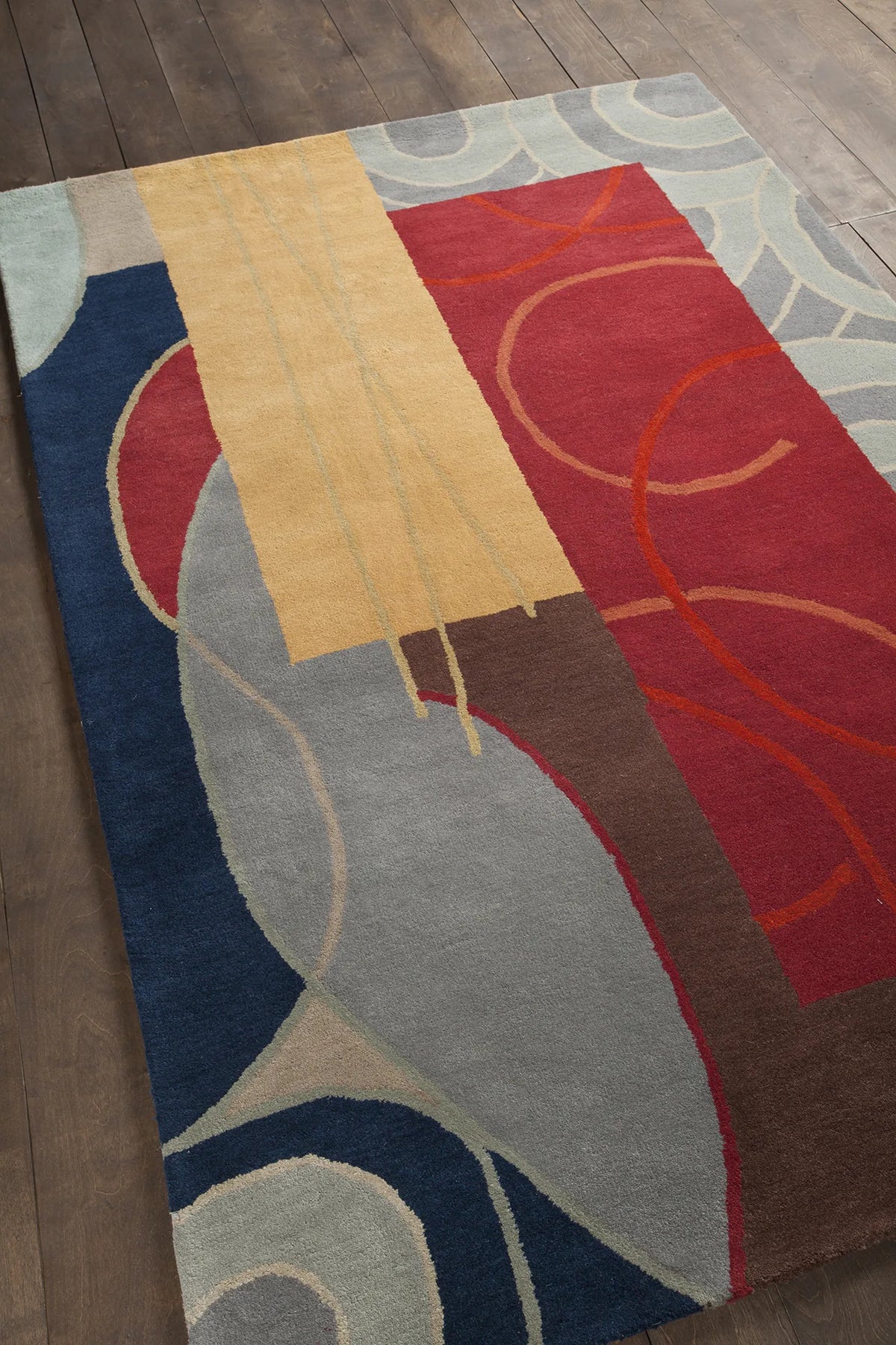 Chandra Bense Garza BEN-3015 Blue and Red and Gold and Grey and Brown rug, angled side view
