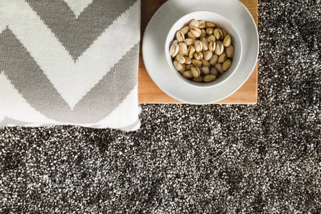 Chandra Blossom BLO-29400 Charcoal and Grey and Ivory rug, styled detail view