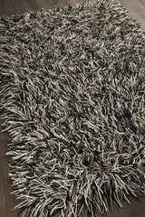Chandra Cyrah CYR-10802 Black and Taupe and Ivory rug, angled side view