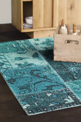 Chandra Fusion FUS-26303 Teal and Black rug, shown in a styled room setting